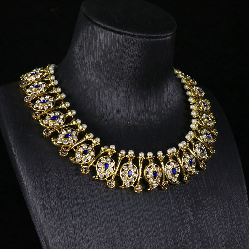 Vintage palace style sapphire necklace and earring set densely inlaid with full diamonds